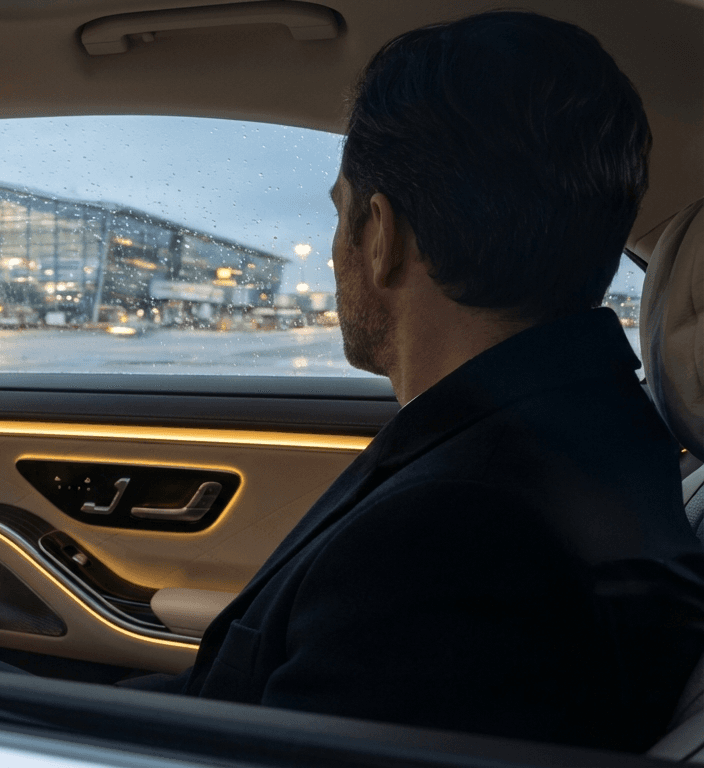 Passenger in rear seat approaching airport