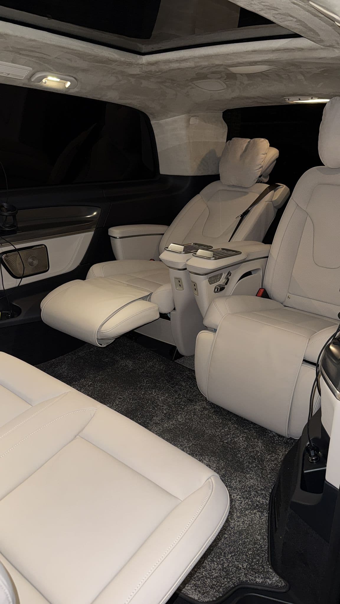 Luxury van with white leather captain chairs
